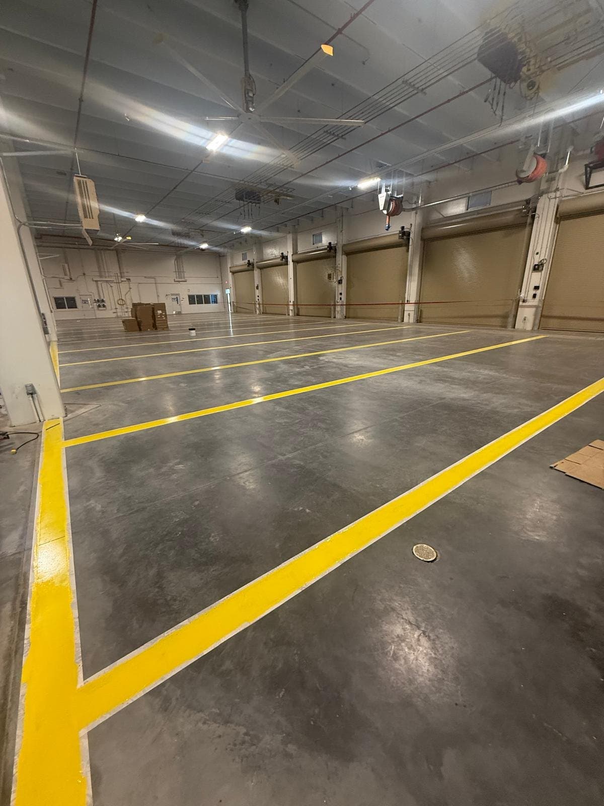 Parking garage floor coating and safety striping