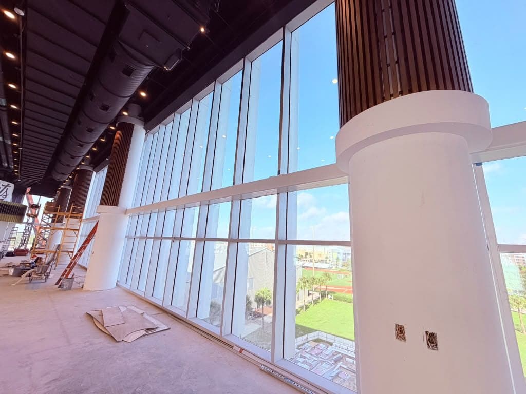 Glass atrium interior with painted columns - commercial