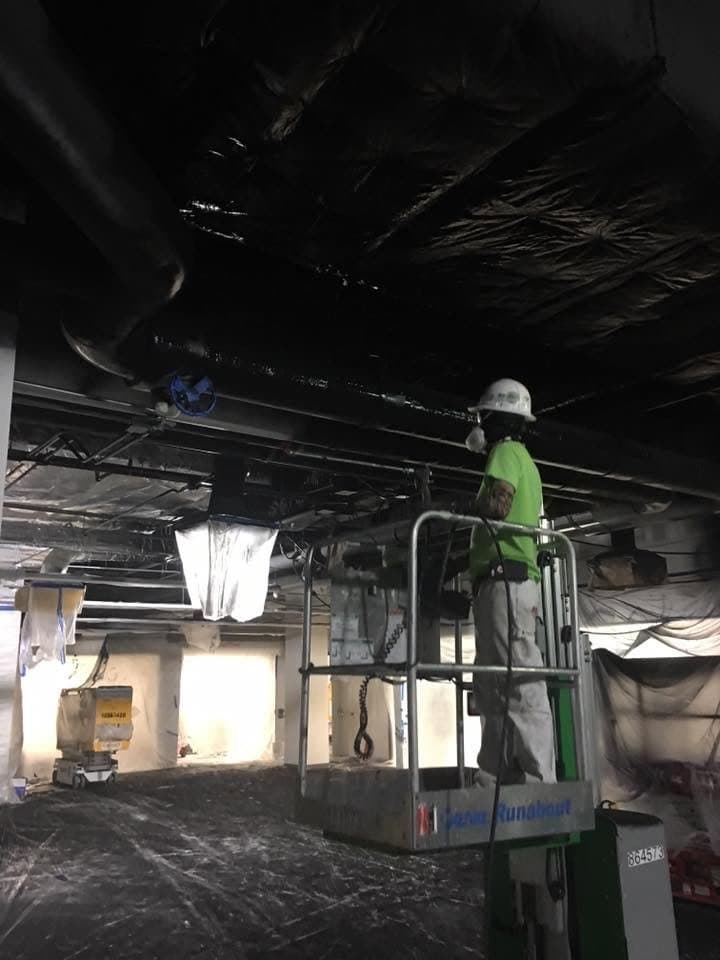 Commercial painting from lift - ceiling work