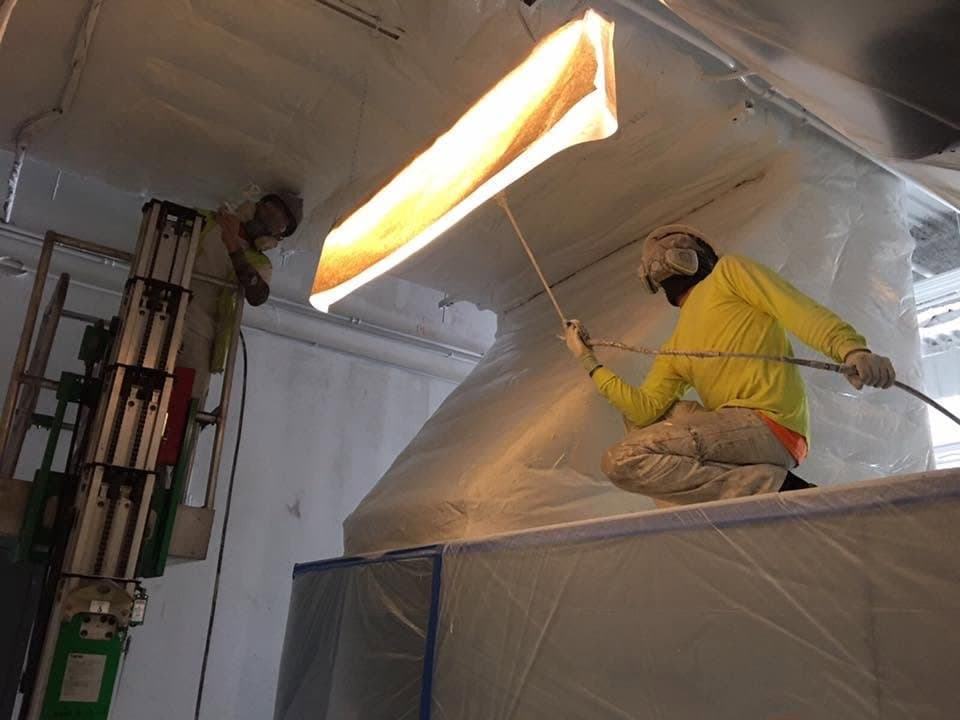 Commercial spray painting crew at work