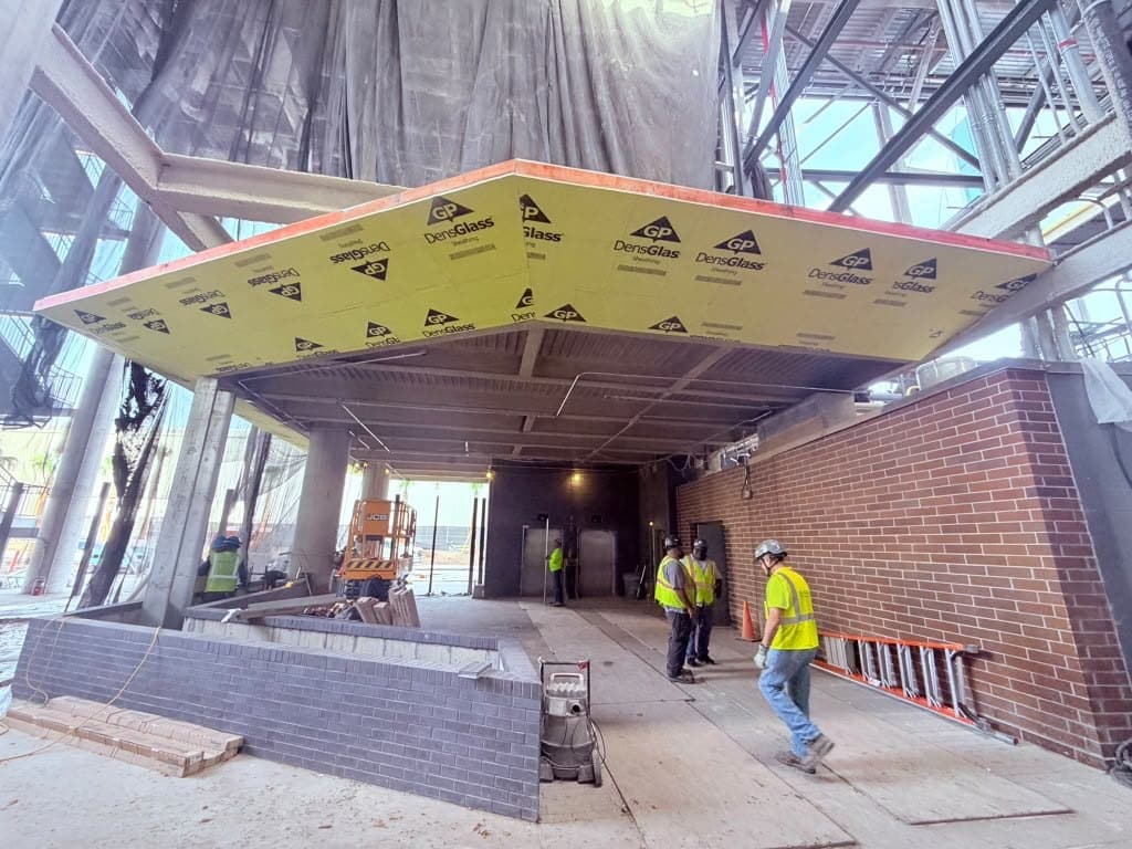 Wood canopy soffit installation and finish - commercial