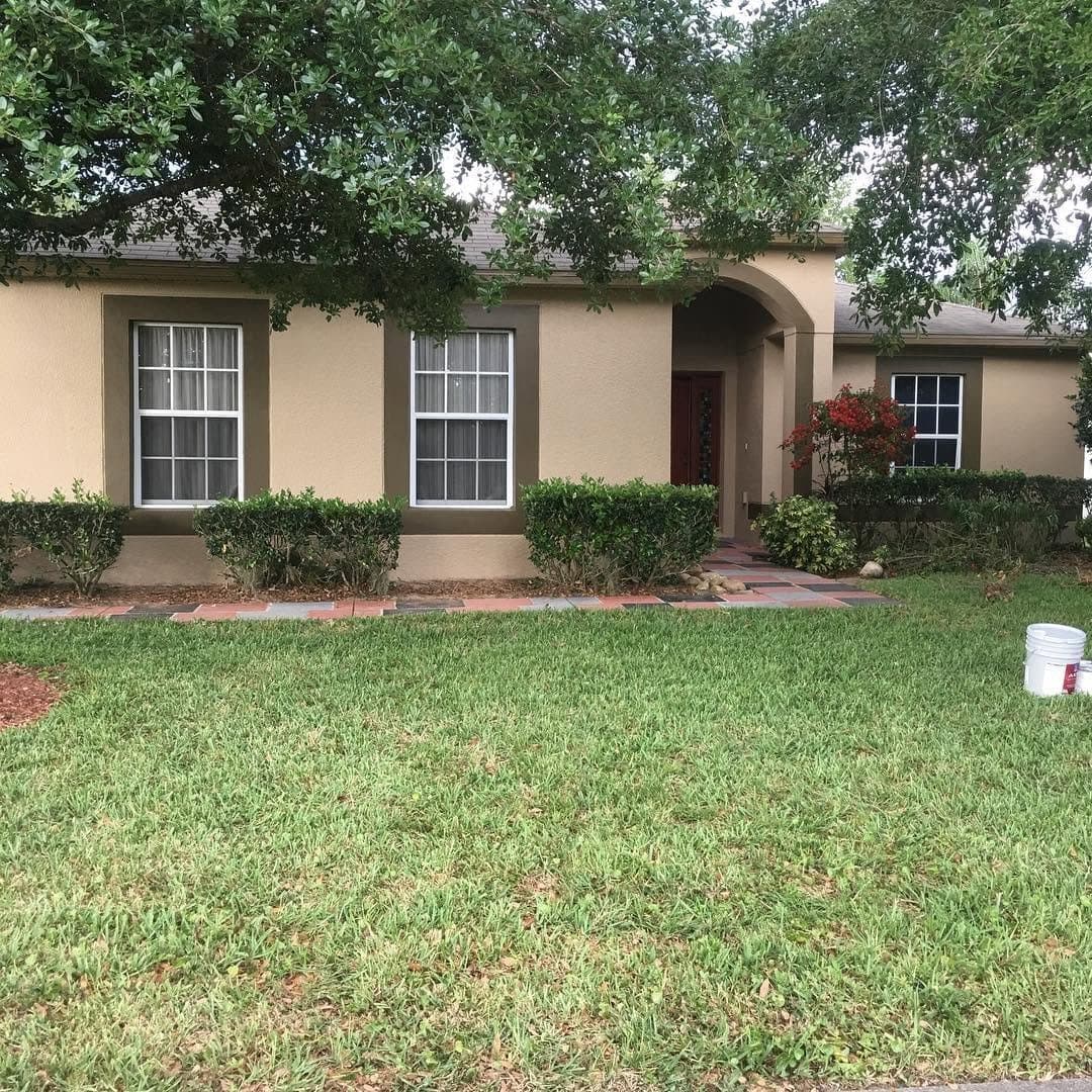 Beige exterior home painting - entry detail