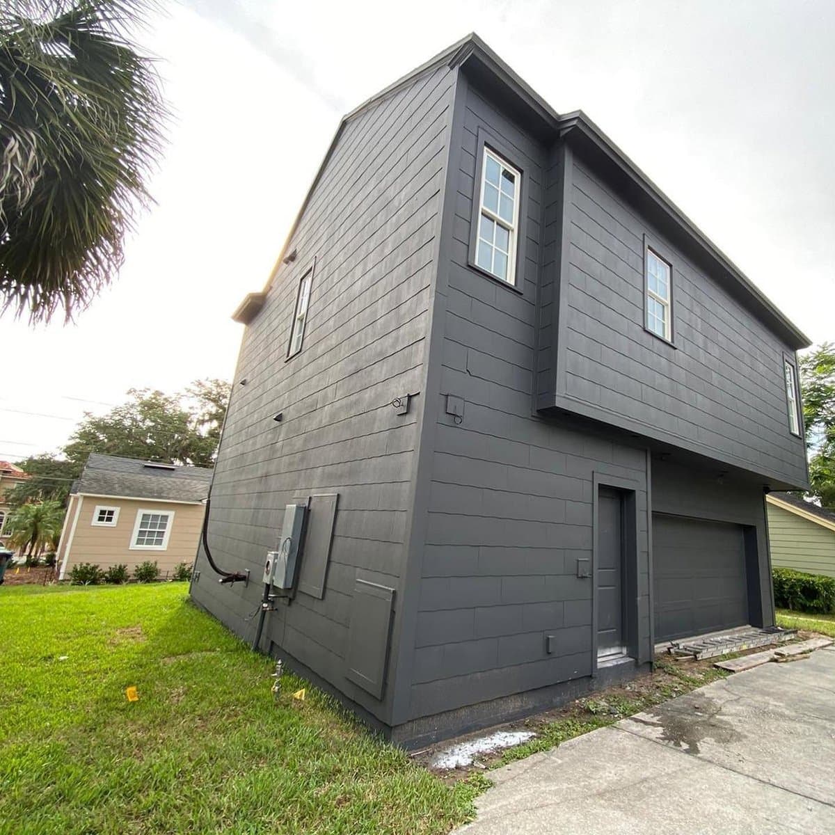 Dark gray exterior home painting - back view