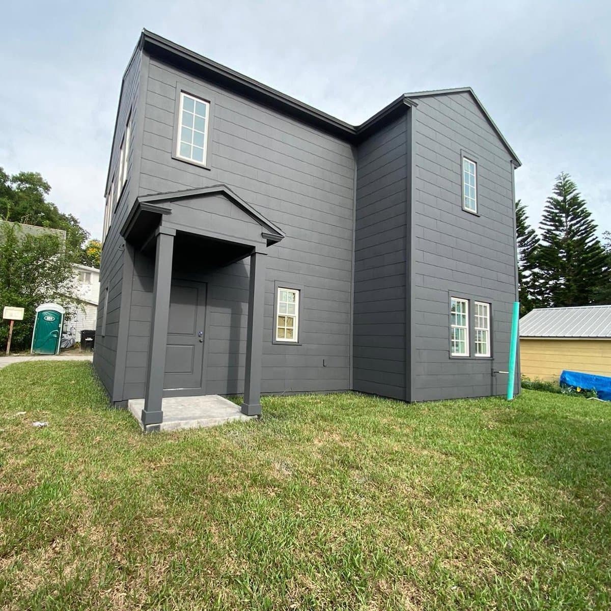 Modern dark gray exterior home painting - front view