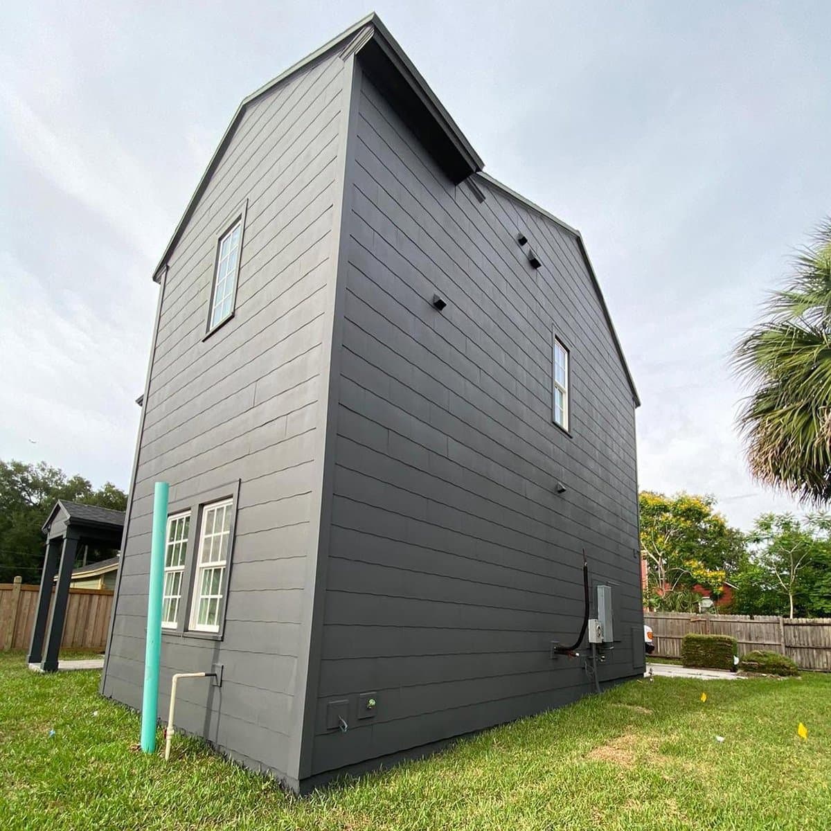Dark gray exterior home painting - side view