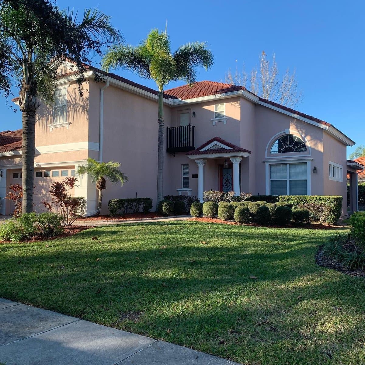 Stucco home exterior painting - wide view